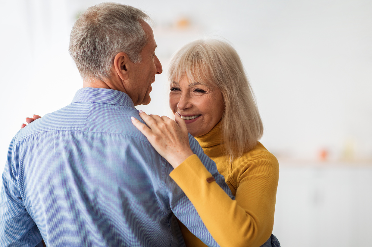 Loving Older Couple Dancing Celebrating Anniversary at Home